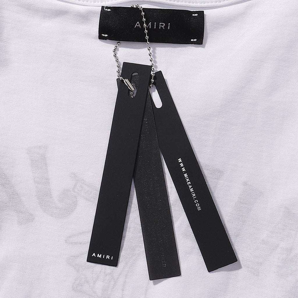 AMIRI Los Angeles Paint-Splatter Graphic T-Shirt — hang_tag
